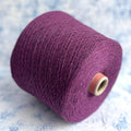 Rich violet melange yarn with a subtle sheen, fine twist, and delicate halo, showcasing the luxurious cashmere silk blend.