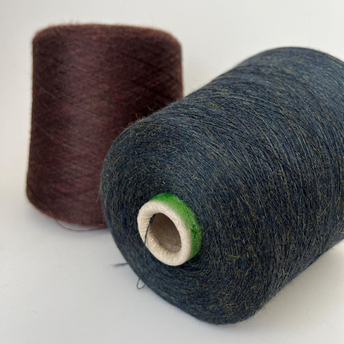 Soft, plush, deep marron brown yarn with a gentle, even twist, showcasing a subtle sheen and delicate halo. Neatly wound into a luxurious skein.