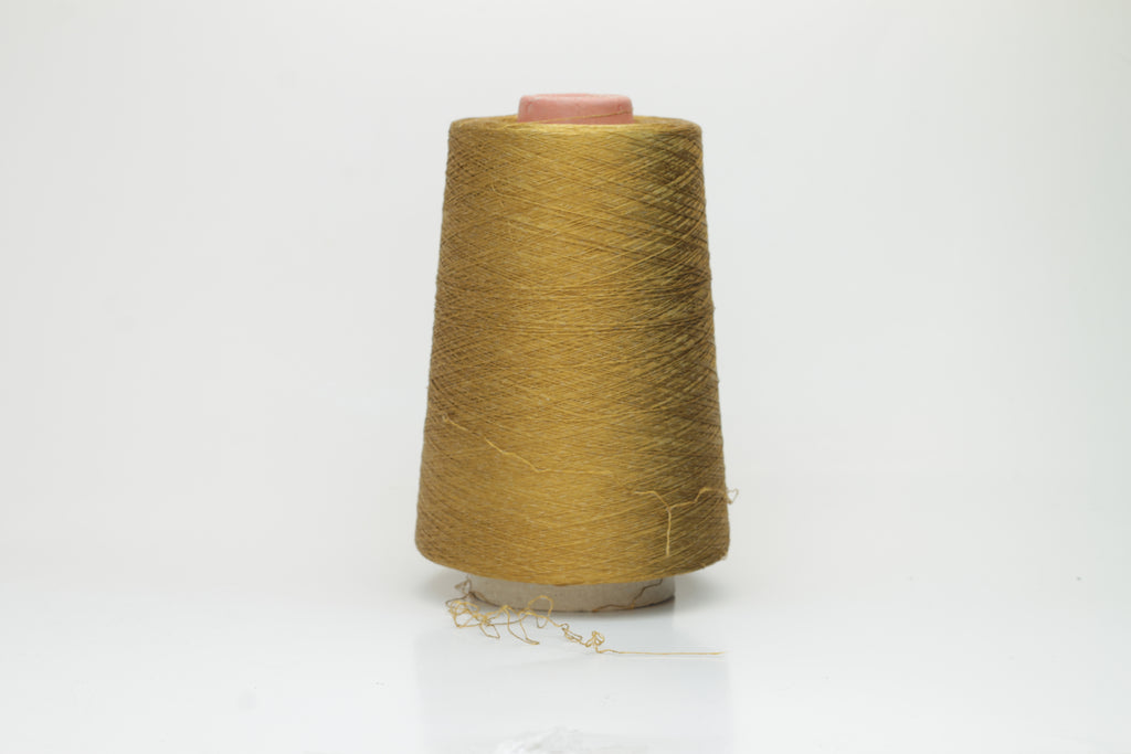 Luxurious deep bronze yarn with a distinct spiral twist, showcasing a radiant metallic sheen and smooth, tightly spun fibers.