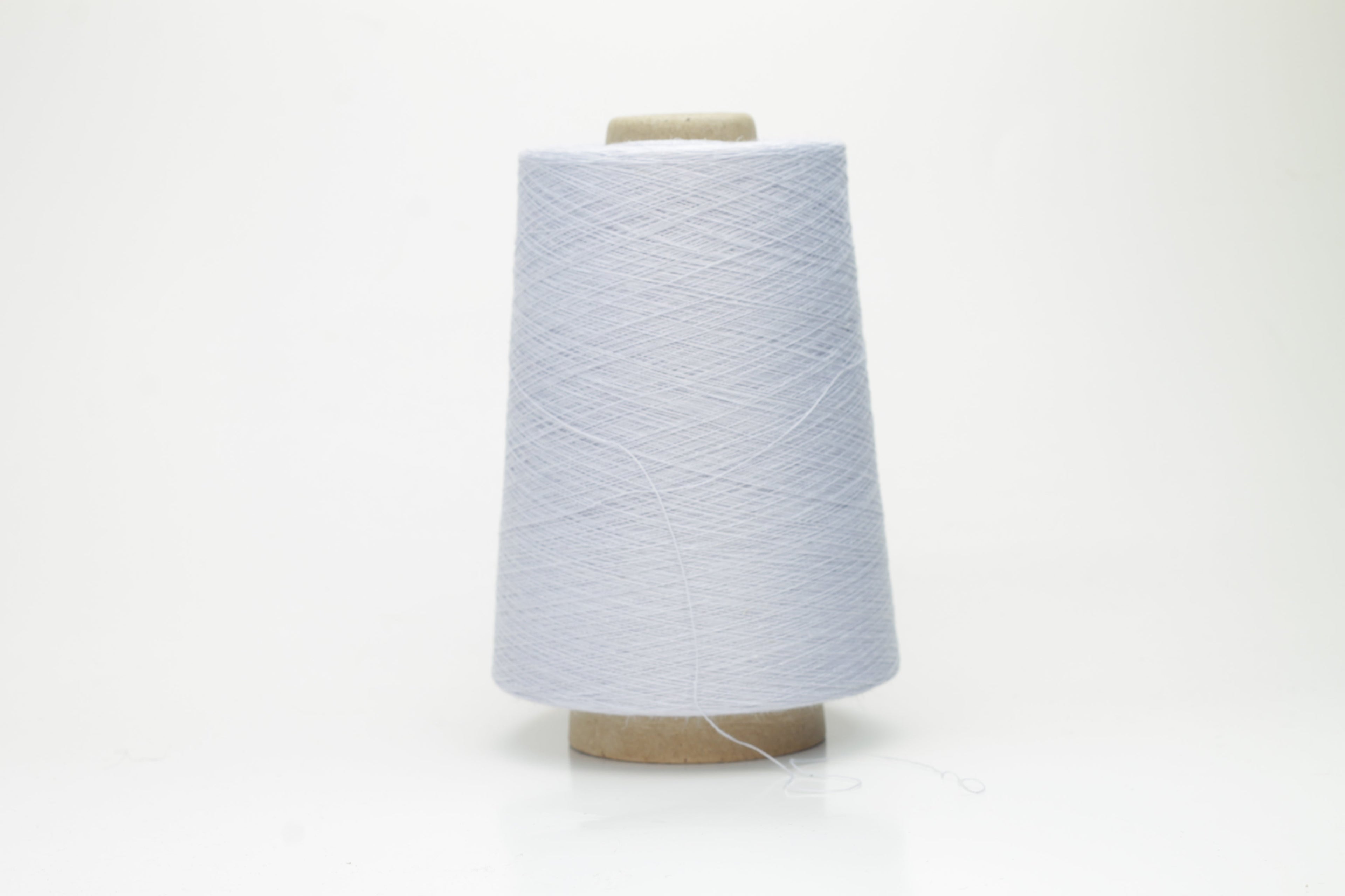 Vibrant cerulean blue yarn, a fine two-ply twist. Subtle lino sheen with soft cotton texture, creating a structured, natural fiber strand.