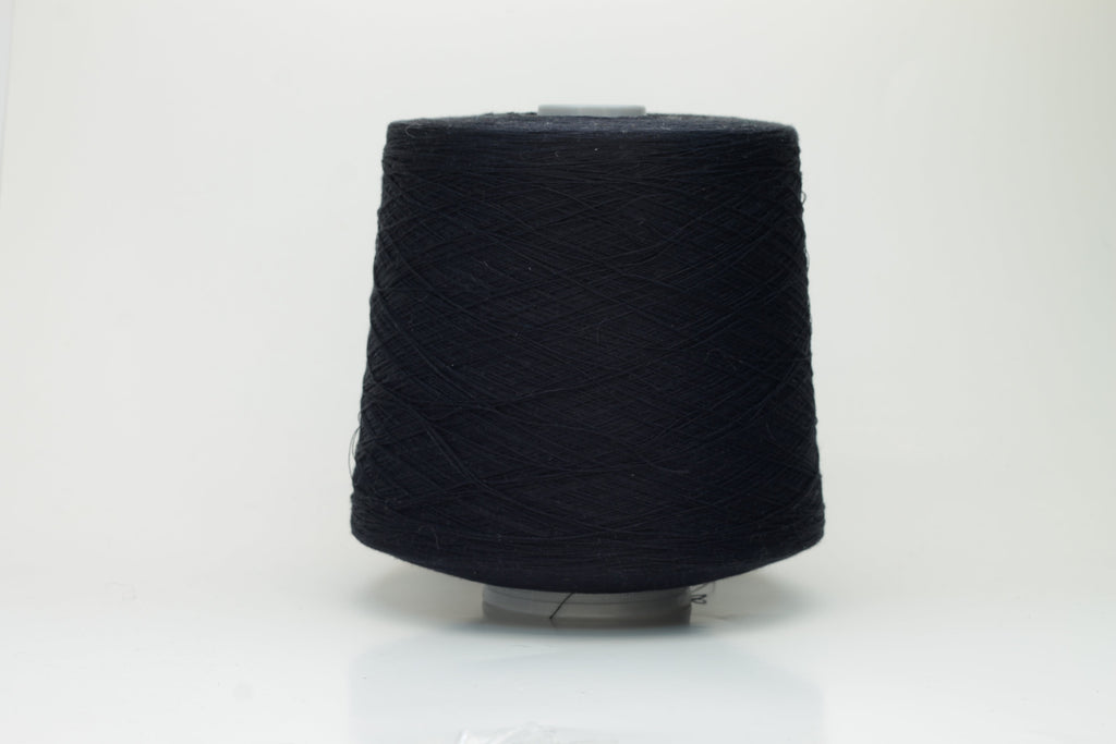 Close-up of a single strand of lustrous black yarn, its smooth, compact twist revealing subtle silk sheen over cotton fibers. The even ply suggests strength and a refined finish.