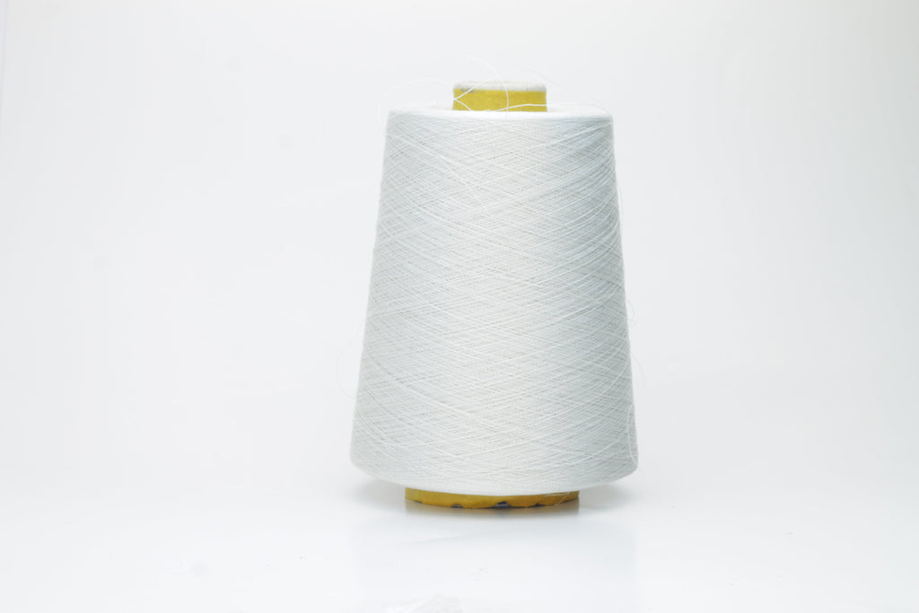 Coiled skein of finely spun, two-ply light gray yarn with a subtle, cool metallic sheen, demonstrating a smooth, uniform twist and refined texture.