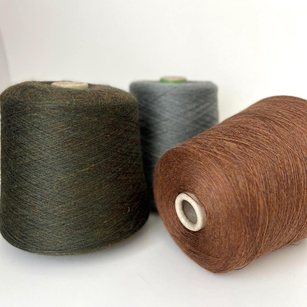 Soft, slightly twisted strand of luxury cashmere-alpaca yarn in a rich, nuanced moleskin grey-brown with a delicate halo and subtle sheen.