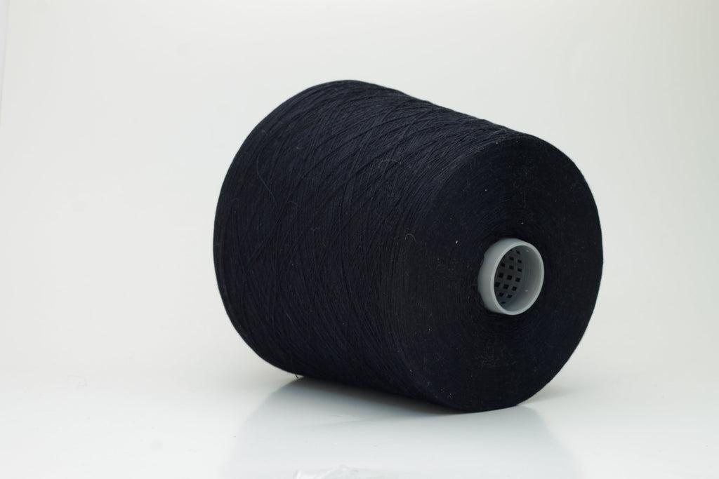 Close-up of a single strand of lustrous black yarn, its smooth, compact twist revealing subtle silk sheen over cotton fibers. The even ply suggests strength and a refined finish.