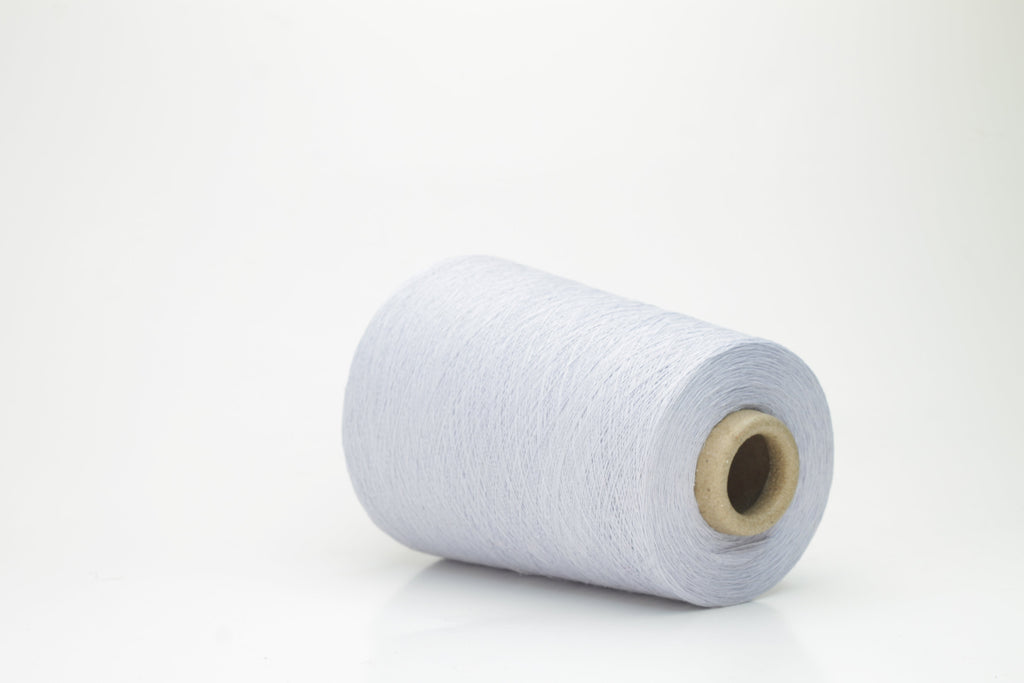 Vibrant cerulean blue yarn, a fine two-ply twist. Subtle lino sheen with soft cotton texture, creating a structured, natural fiber strand.