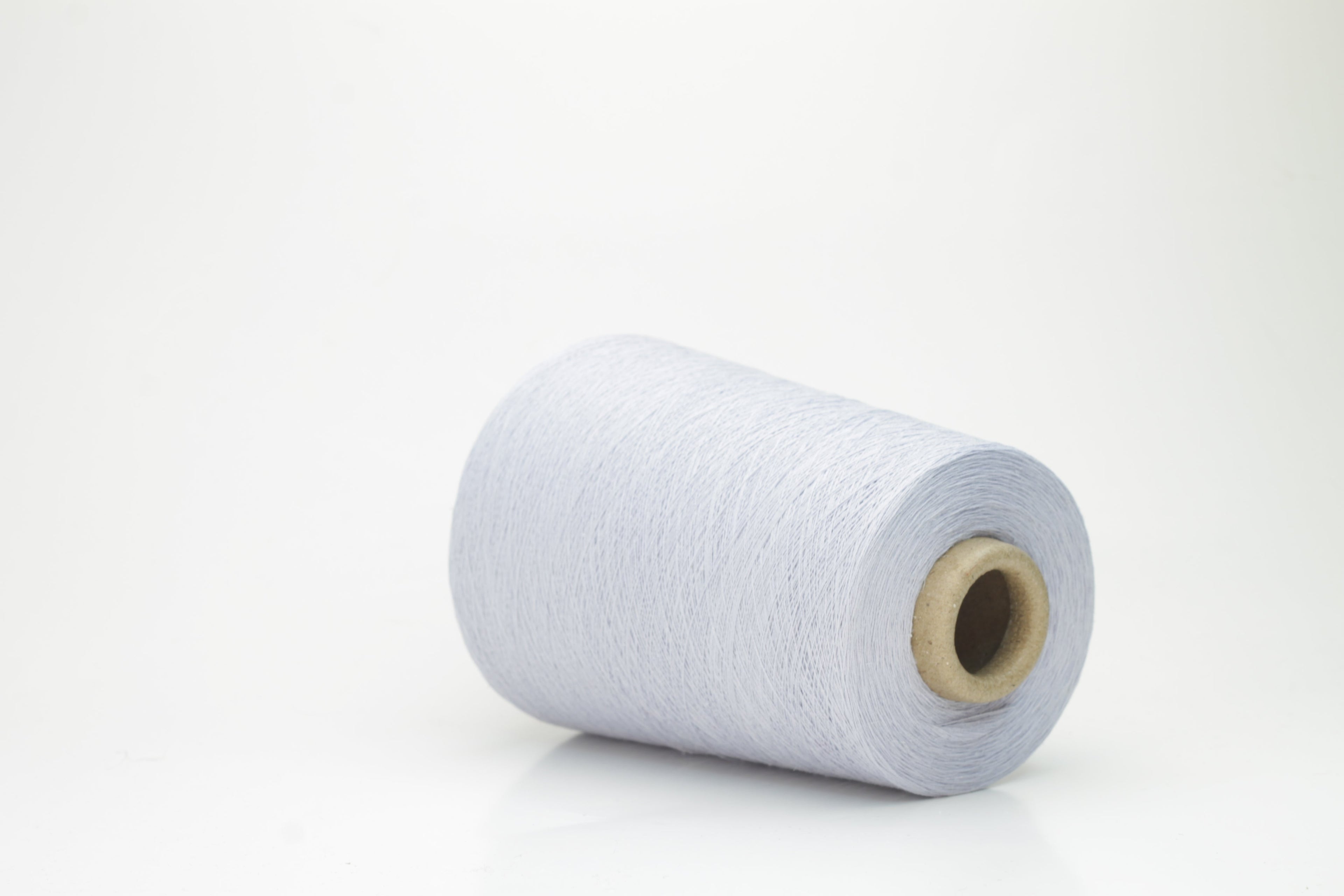 Vibrant cerulean blue yarn, a fine two-ply twist. Subtle lino sheen with soft cotton texture, creating a structured, natural fiber strand.