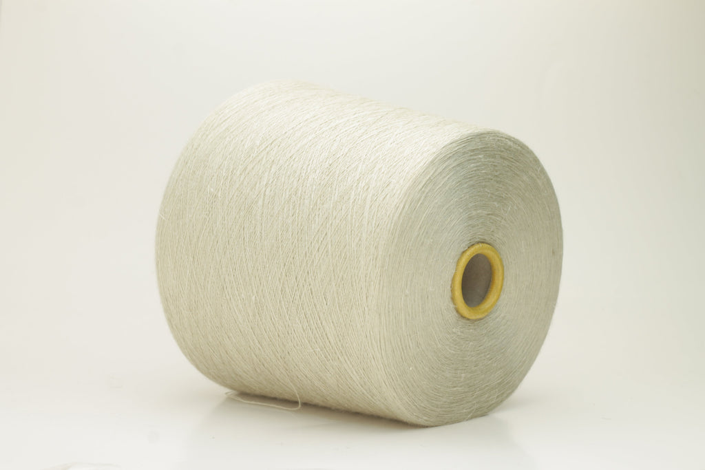 Close-up of a delicate, smoothly twisted light gray yarn strand, showing fine ply definition, subtle sheen, and gentle fluff.