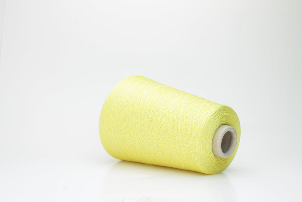 A finely spun, single-ply yarn in a vibrant, sunny golden-yellow. Smooth silk-cotton blend with a subtle, luxurious sheen and delicate twist.