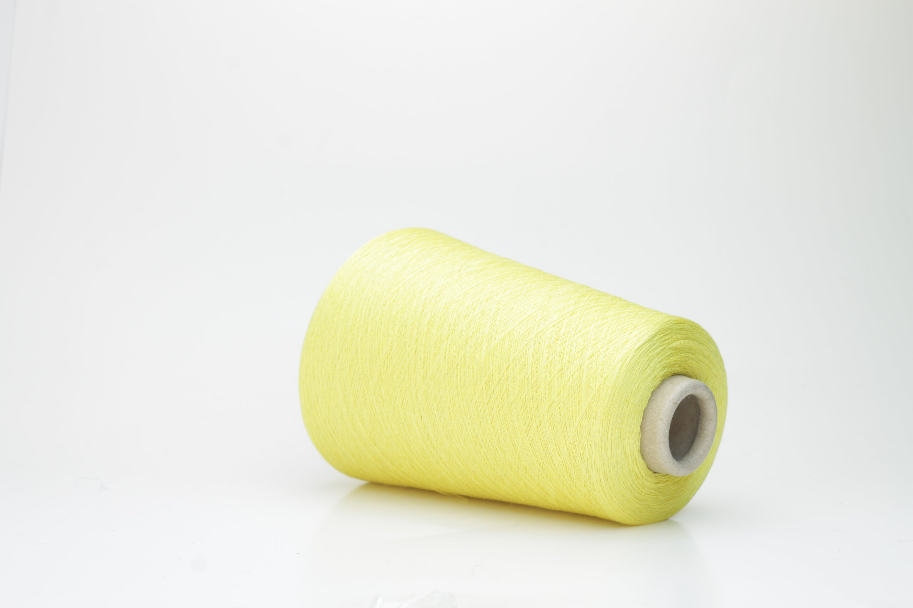 A finely spun, single-ply yarn in a vibrant, sunny golden-yellow. Smooth silk-cotton blend with a subtle, luxurious sheen and delicate twist.