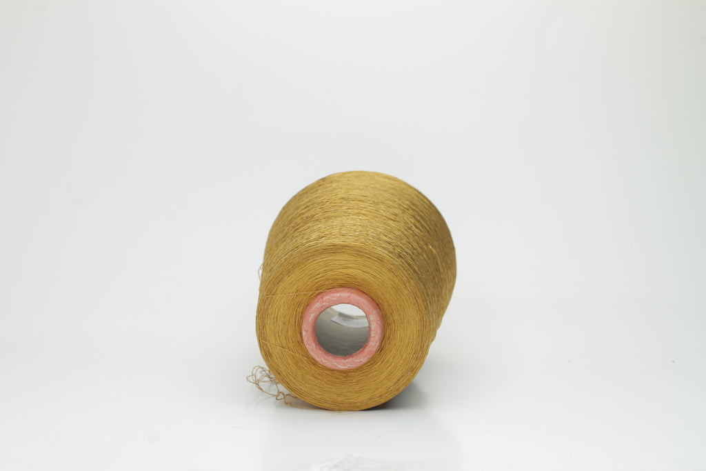 Luxurious deep bronze yarn with a distinct spiral twist, showcasing a radiant metallic sheen and smooth, tightly spun fibers.