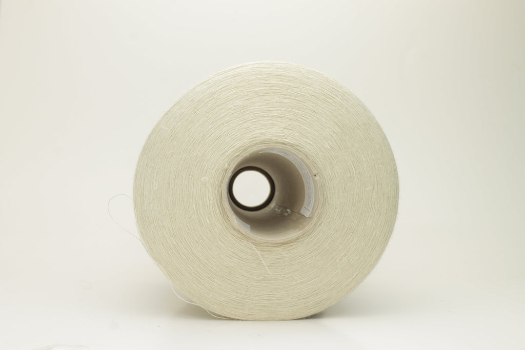 Close-up of a delicate, smoothly twisted light gray yarn strand, showing fine ply definition, subtle sheen, and gentle fluff.