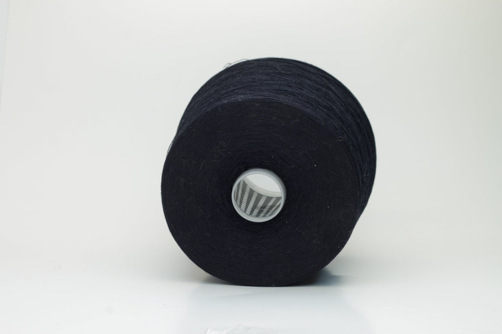 Close-up of a single strand of lustrous black yarn, its smooth, compact twist revealing subtle silk sheen over cotton fibers. The even ply suggests strength and a refined finish.
