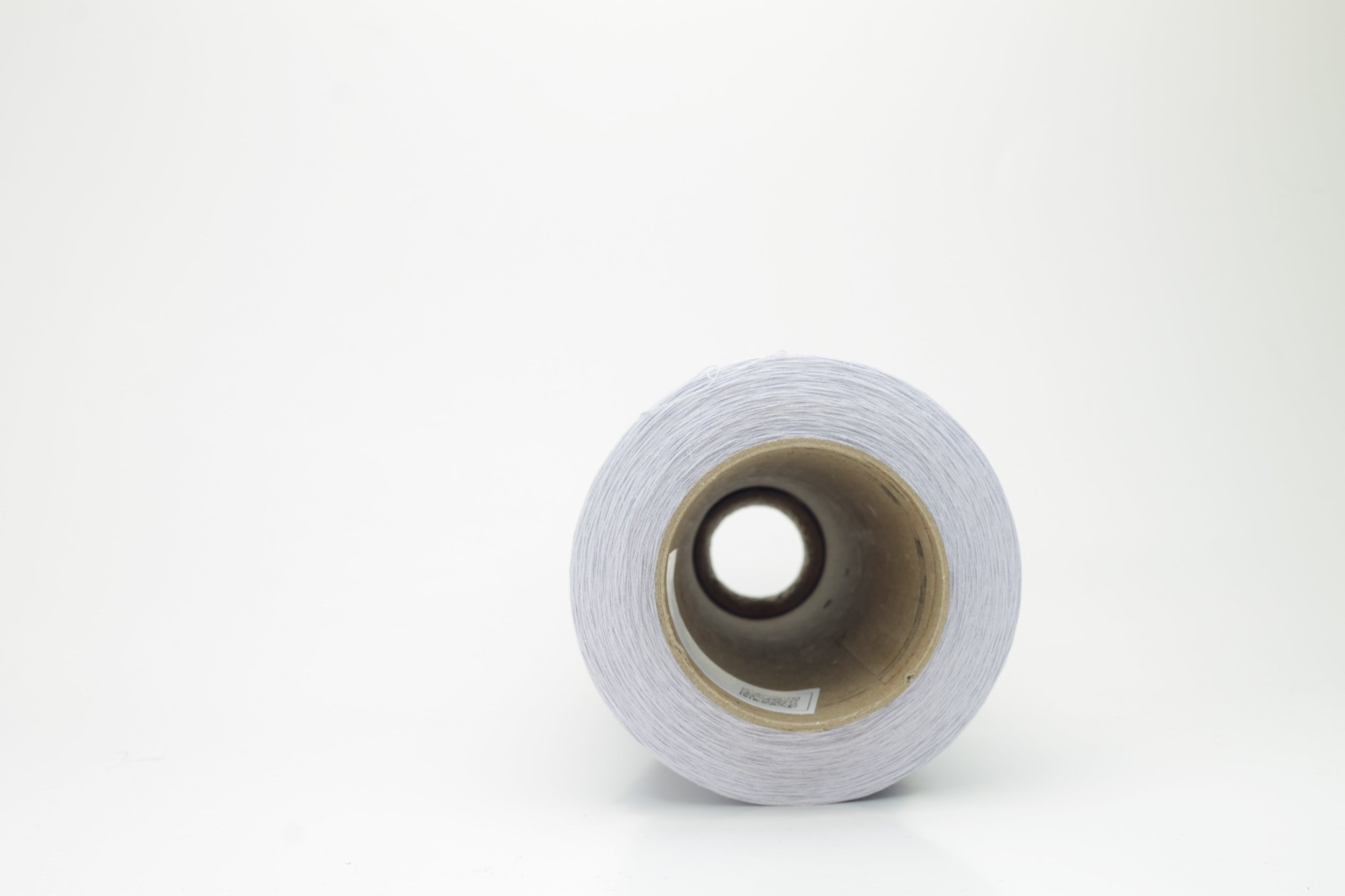 Vibrant cerulean blue yarn, a fine two-ply twist. Subtle lino sheen with soft cotton texture, creating a structured, natural fiber strand.