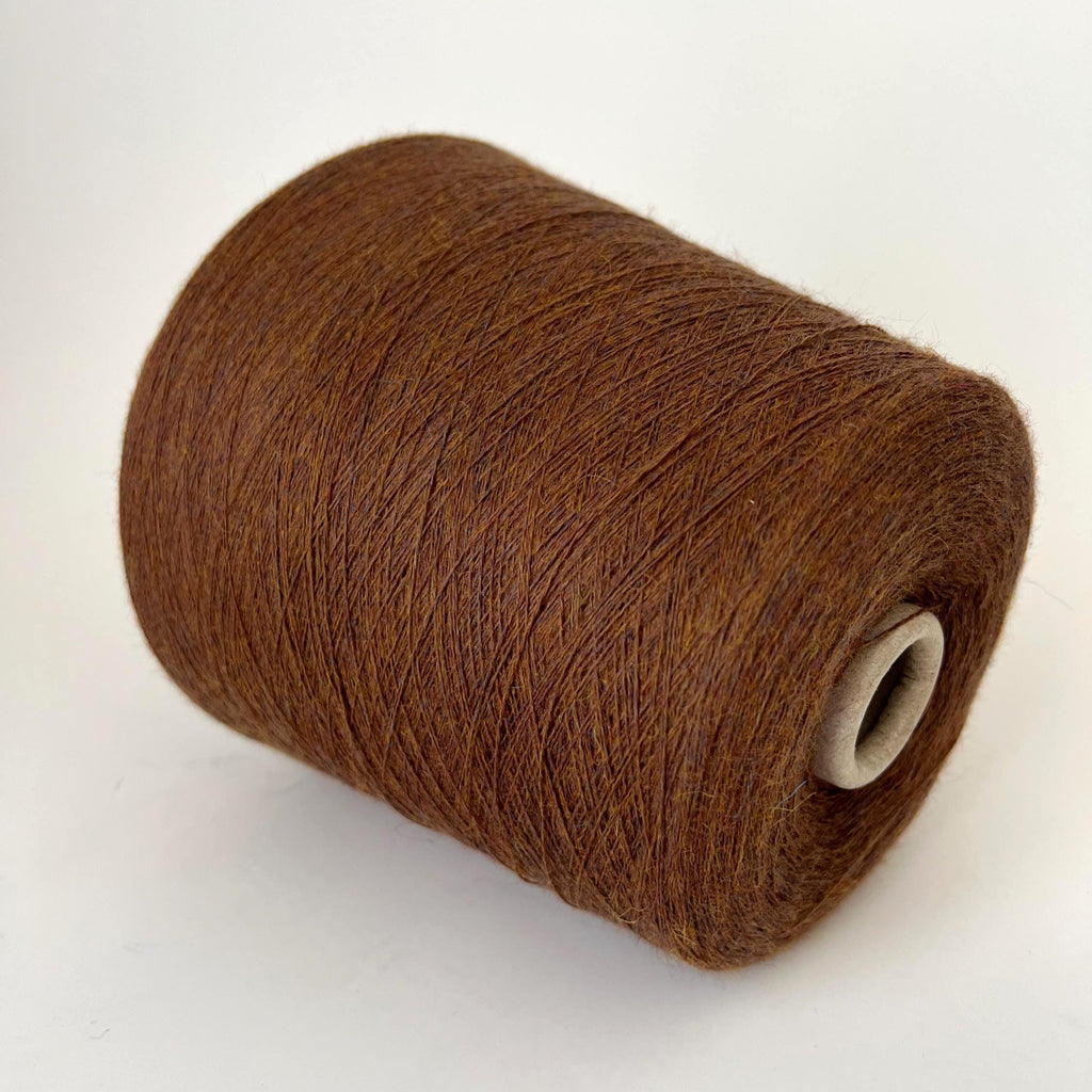 Soft, slightly twisted strand of luxury cashmere-alpaca yarn in a rich, nuanced moleskin grey-brown with a delicate halo and subtle sheen.