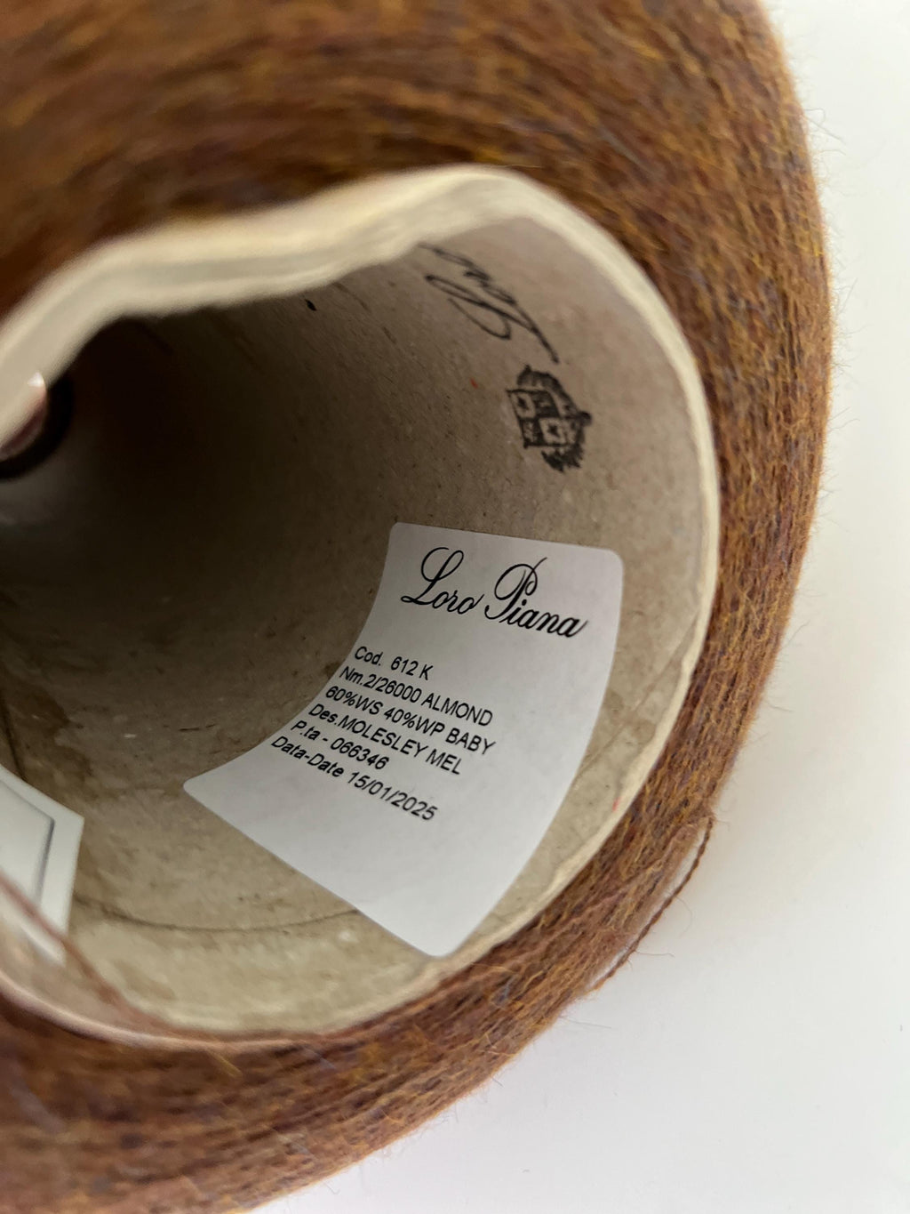 Soft, slightly twisted strand of luxury cashmere-alpaca yarn in a rich, nuanced moleskin grey-brown with a delicate halo and subtle sheen.